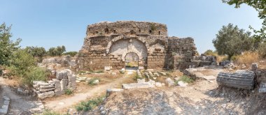 Exterior high resolution panoramic view of Faustina Baths  Ruins at Miletus Ancient Greek City in Didim,Aydin,Turkey. clipart