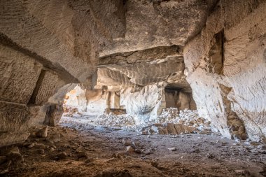 Interior view of Bazda Caves for mining of stone in Harran,Sanliurfa,Turkey clipart