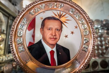 Poster of Turkish Prime Minister Recep Tayyip Erdogan on a copper tray for sale in Sanliurfa,Turkey.19 July 201 clipart