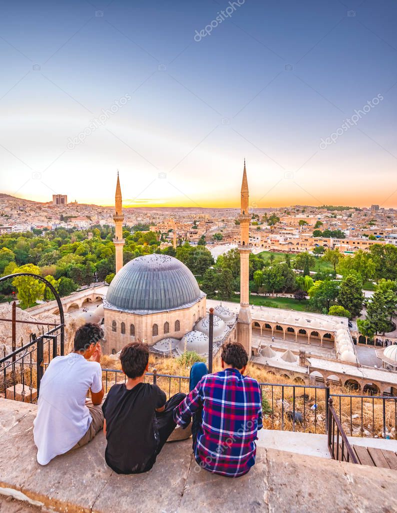 Unidentified people look over Mevlidi Halil Mosque,one of landmarks in Sanliurfa,Turkey.18 July 201