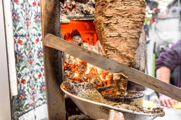 Grilled skewered lamb mutton,traditional meat served in shawarma or kebab sandwich in stainless steel grill machine Istanbul,Turkey.