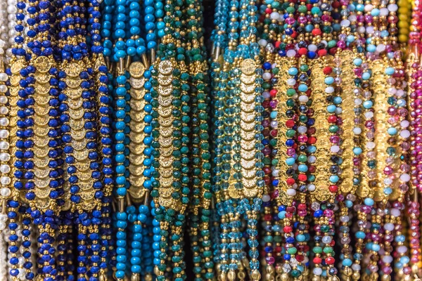 Collection of Traditional Turkish colorful bead bracelets made from glass on display for sale in a Turkish bazaar