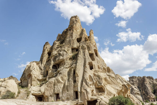 Fairy tale chimneys in Cappadocia with blue sky on background in Goreme,Nevsehir, Turkey