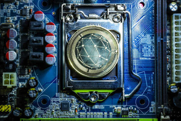 Top view of golden Qtum cryptocurrency physical coin