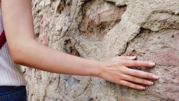 Slow Motion Beautiful Young Girl Touches Wall While Walking Street — Stock Video