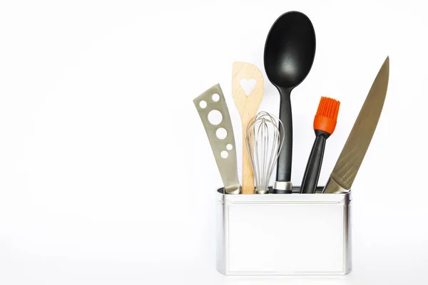 Kitchen utensils in a silver colored metal box — Stock Photo, Image