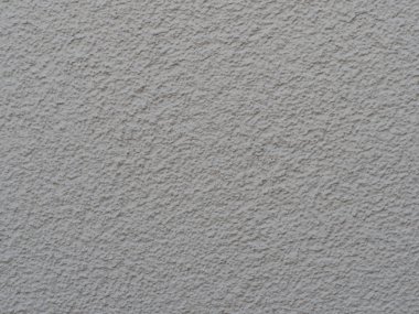 yapısal sıva closeup ile beyaz boyalı duvar / makro gölgesinde