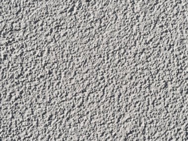 yapısal sıva closeup ile beyaz boyalı duvar / makro güneş ışığı altında