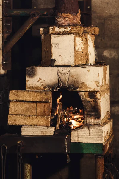 Close up photo of homemade forge furnace with flame. — Stock Photo, Image