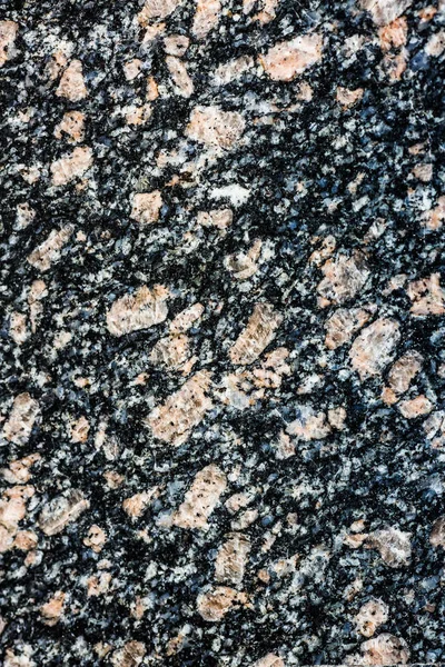 Polished granite. Real natural gray granite stone texture and surface background.
