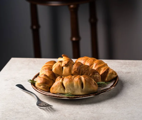 sausage rolls, on a grey marble surface, festive background, Christmas party food ideas