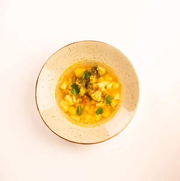 winter meal of soup, homemade, green bowl, light backdrop