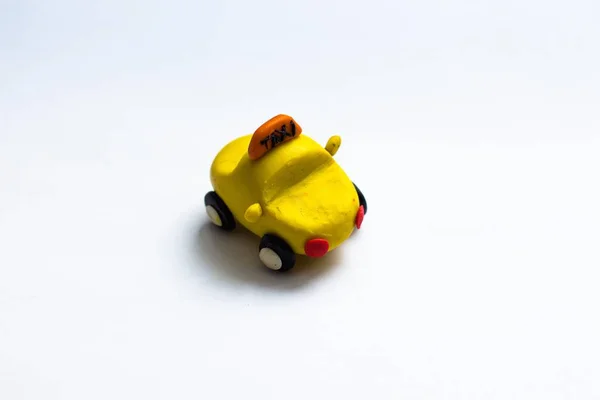 Small Yellow Cab Made Plasticine Stands White Background Car Wheels — Stock Photo, Image