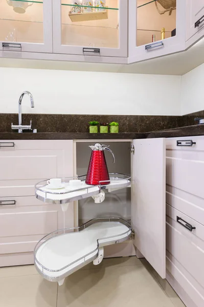 Kitchen corner unit with pullout shelves — Stock Photo, Image