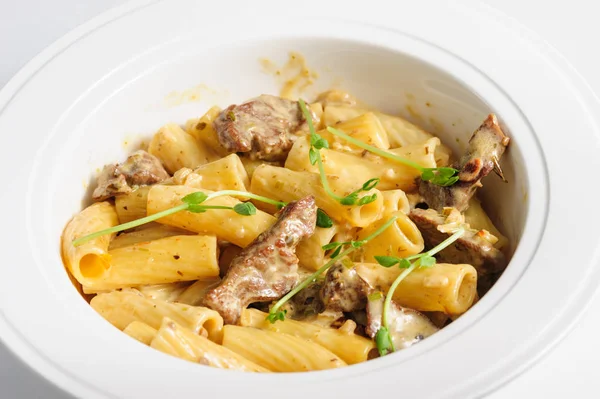 Penne pasta with veal meat — Stock Photo, Image