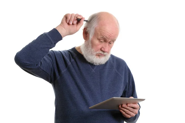 Funny old man using tablet computer and puzzled, isolated on white — Stock Photo, Image
