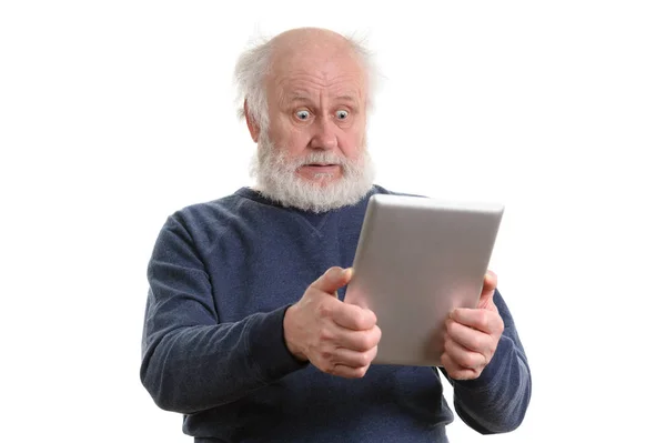 Funny shocked senior man using tablet computer isolated on white — Stock Photo, Image