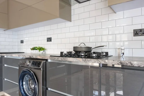 Closeup of luxury modern white, beige and grey kitchen interior — Stock Photo, Image