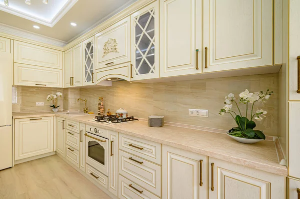 Beige furniture at kitchen in provence style, angle view