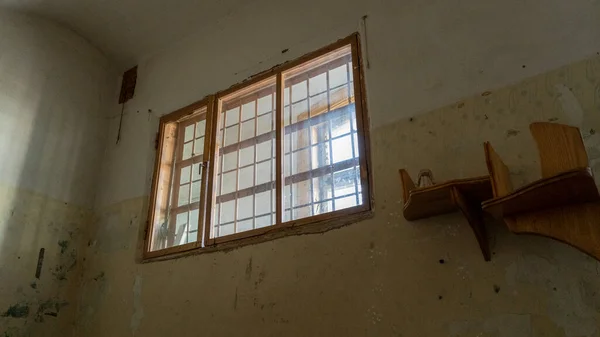 Light Coming in Through Prison Cell Bars Window. Empty Jail Cells. Prison Interior. Concept of Limiting Freedom.