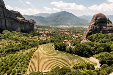 Meteors or Meteora Monastery Vineyards with the view of Kalabaka and Kastraki Villages, Thessaly, Greece clipart