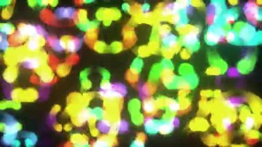 Soyut Çok Renkli Parlayan Parçacıklar Dönen Dönen Döngü / 4k Soyut bir arkaplan karışımı Renkli parlayan ve parlayan parçacıklar dönen ve kusursuz döngü