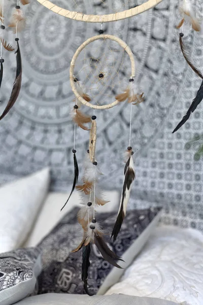 Dream catcher over the bed./The Dream catcher over the bed with pillows in Scandinavian style.