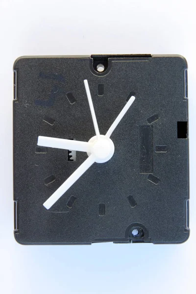 Wall clock mechanism. Plastic clock mechanism. Clock technology.