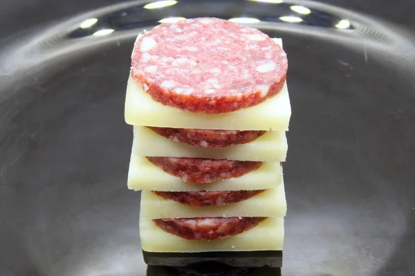 Salami and cheese snack. Snack food. Small bites of salami and cheese.