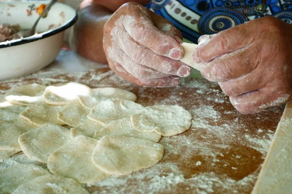 Home-made recipe for dumplings (raviol)i. Traditionally, women of the older generation mold the dumplings in the family.