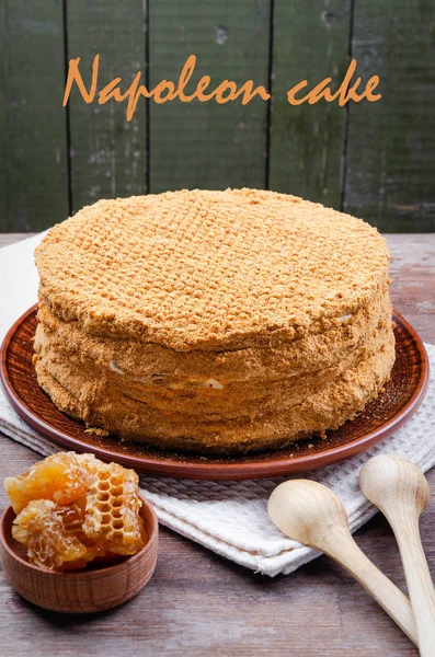 Traditional Honey Cake on a plate and on a wooden table