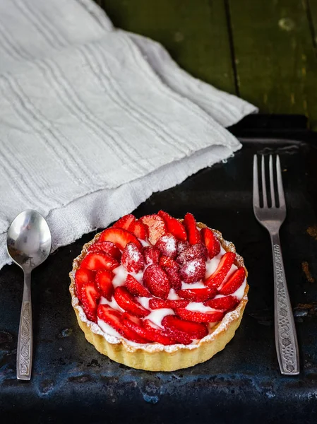 Strawberry shortcake pies (Strawberries tartlet) on black background, perfect party individual fresh fruit dessert