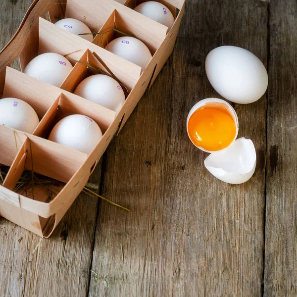 eggs in wooden box on old wooden background