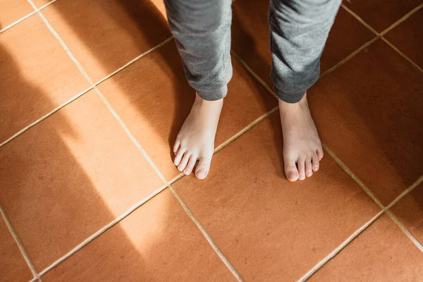 Boy\'s feet on the floor