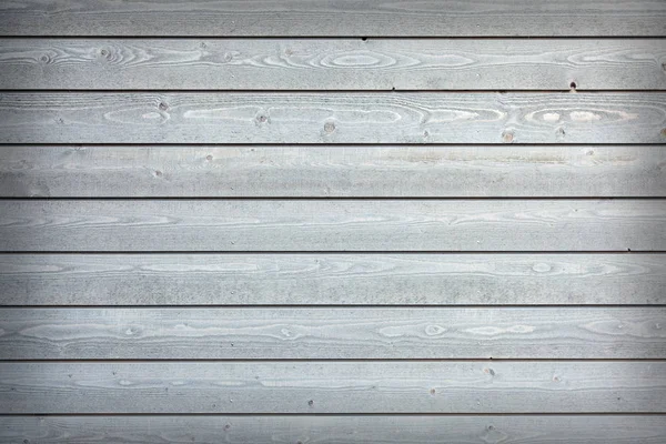 Horizontal wooden planks with grey paint on fence — Stock Photo, Image