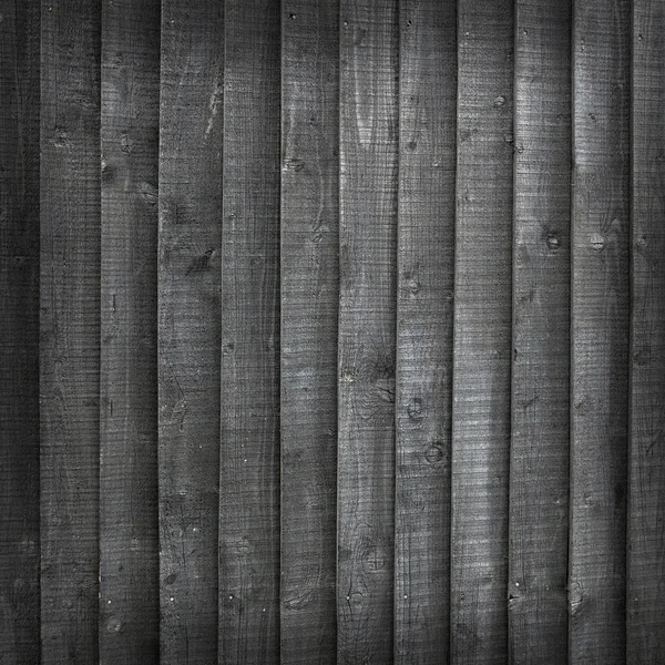 Sfondo costituito da assi di legno tinto nero su recinzione — Foto Stock