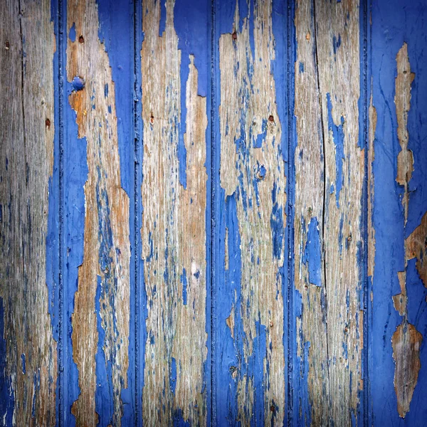 Peeling blue paint on wooden door or fence — Stock Photo, Image