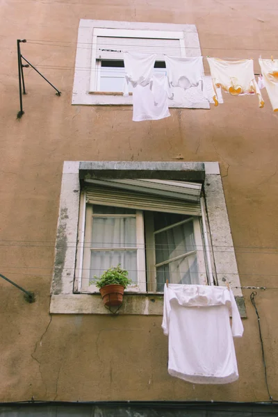 Close up of drying whitee linen on the white window — Stock Photo, Image