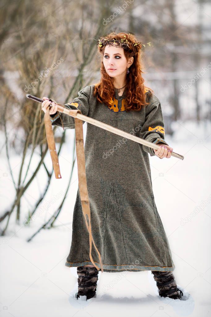 Beautiful woman in viking clothes