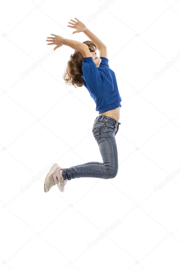Cute teen girl in a jump, isolated on white background
