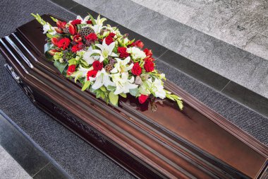 Funeral, beautifully decorated with flower arrangements coffin, close-up clipart