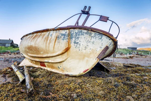 Old rusty boat on the shore, close-up