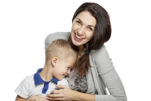 Mom and little son hug and laugh. Tenderness and love. Isolated on a white background. — Stock Photo, Image