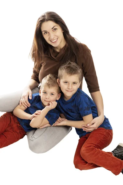 Mom and sons hug and smile. Tenderness and love. Isolated on a w — Stock Photo, Image