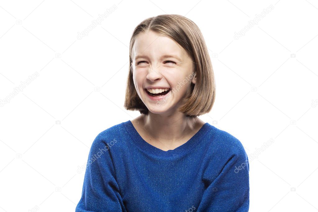 Cute teen girl laughs, closing her eyes. Close-up. Isolated on a white background.