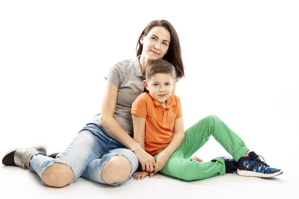 Mom and son hug and smile. White background. — Stock Photo, Image