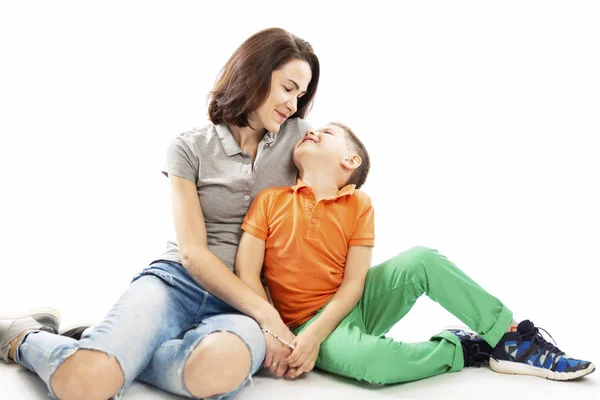 Mom and son hug and smile. White background. — Stock Photo, Image