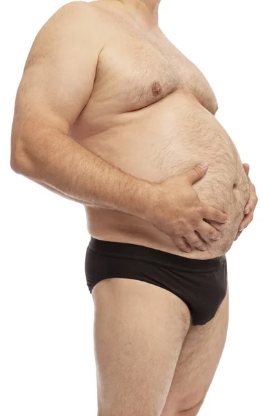 Un hombre con barriga grande. Sobrepeso, Gordo. Primer plano. Aislado sobre un fondo blanco . — Foto de Stock