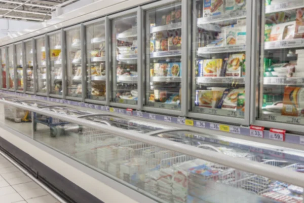 Vidro Mostra Com Alimentos Congelados Grande Supermercado Desfocado — Fotografia de Stock