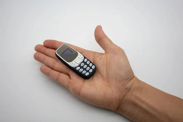Man Hand Holding World Smallest Mobile Phone Oled Screen Blue — Stock Photo, Image
